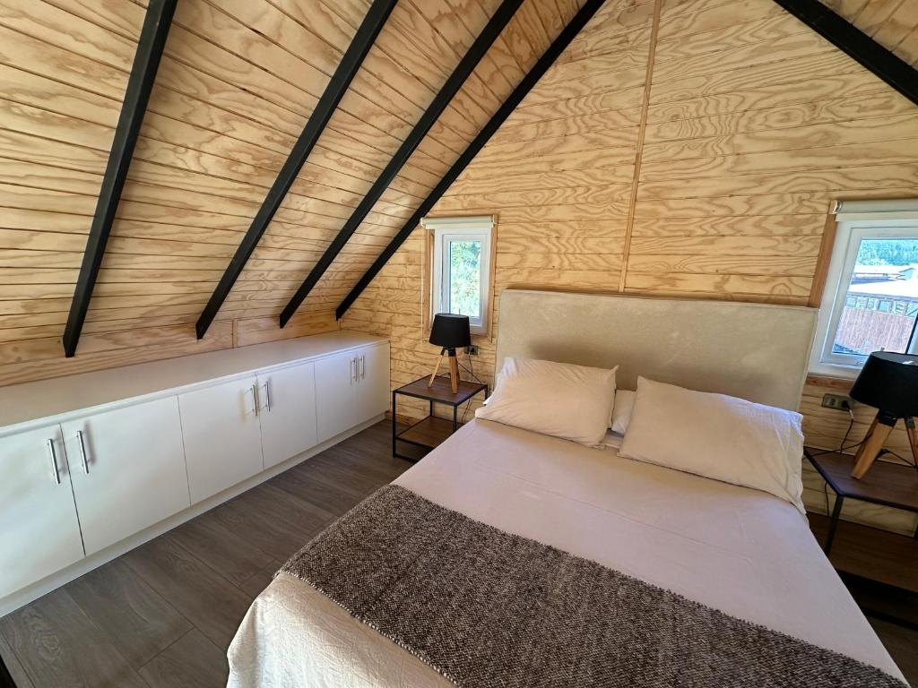 Postel nebo postele na pokoji v ubytování Cabaña Puerta Amarilla