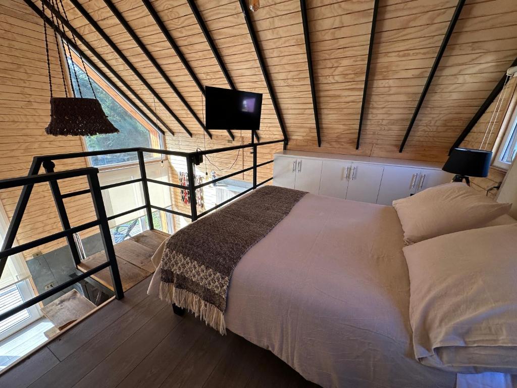 Postel nebo postele na pokoji v ubytování Cabaña Puerta Amarilla