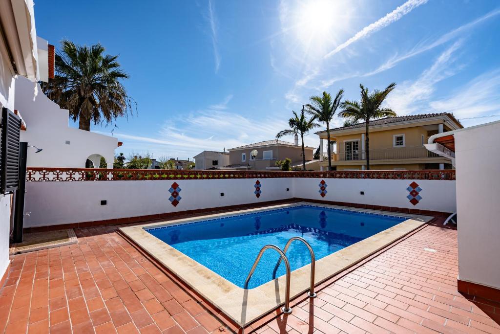 a swimming pool in the backyard of a house at Villa Leonie in Lagos