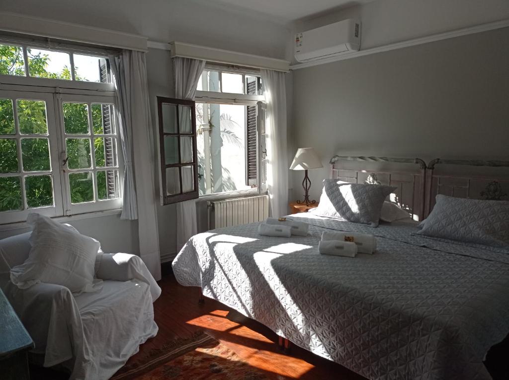Postel nebo postele na pokoji v ubytování Casona de Estilo Inglés