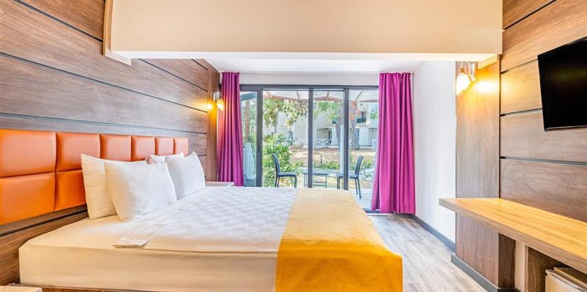 Postel nebo postele na pokoji v ubytování Maya World Didyma Hotel