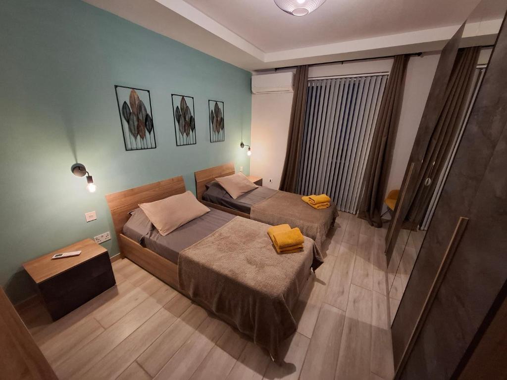 Postel nebo postele na pokoji v ubytování Serenity Apartment
