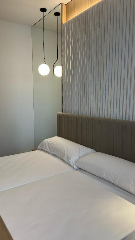 Postel nebo postele na pokoji v ubytování Hotel MLC San Sebastian