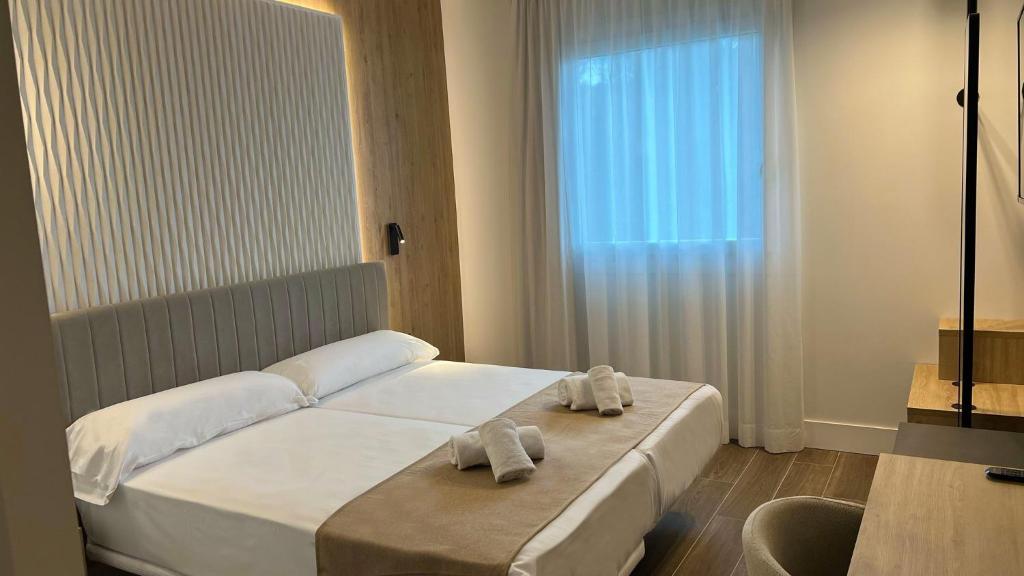Postel nebo postele na pokoji v ubytování Hotel MLC San Sebastian