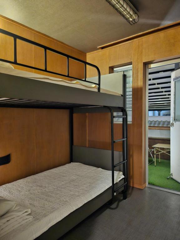 Postel nebo postele na pokoji v ubytování Mido Hostel