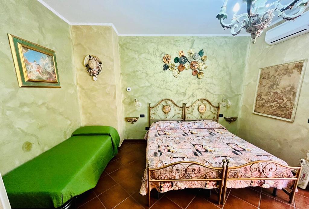 Postel nebo postele na pokoji v ubytování La Mammola Bed&Breakfast