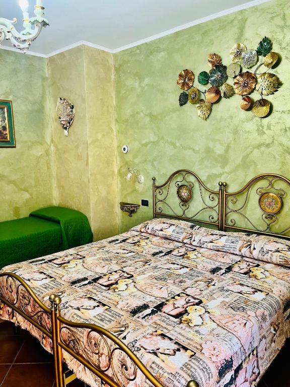 Postel nebo postele na pokoji v ubytování La Mammola Bed&Breakfast