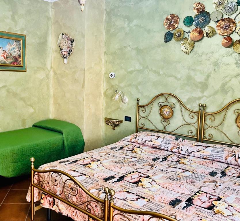 Postel nebo postele na pokoji v ubytování La Mammola Bed&Breakfast