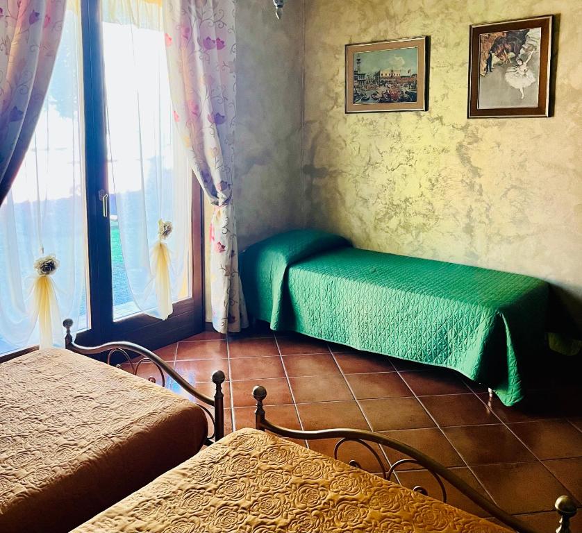 Postel nebo postele na pokoji v ubytování La Mammola Bed&Breakfast