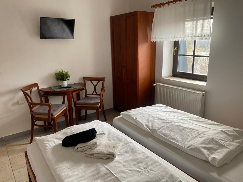 Postel nebo postele na pokoji v ubytování Penzion Janata
