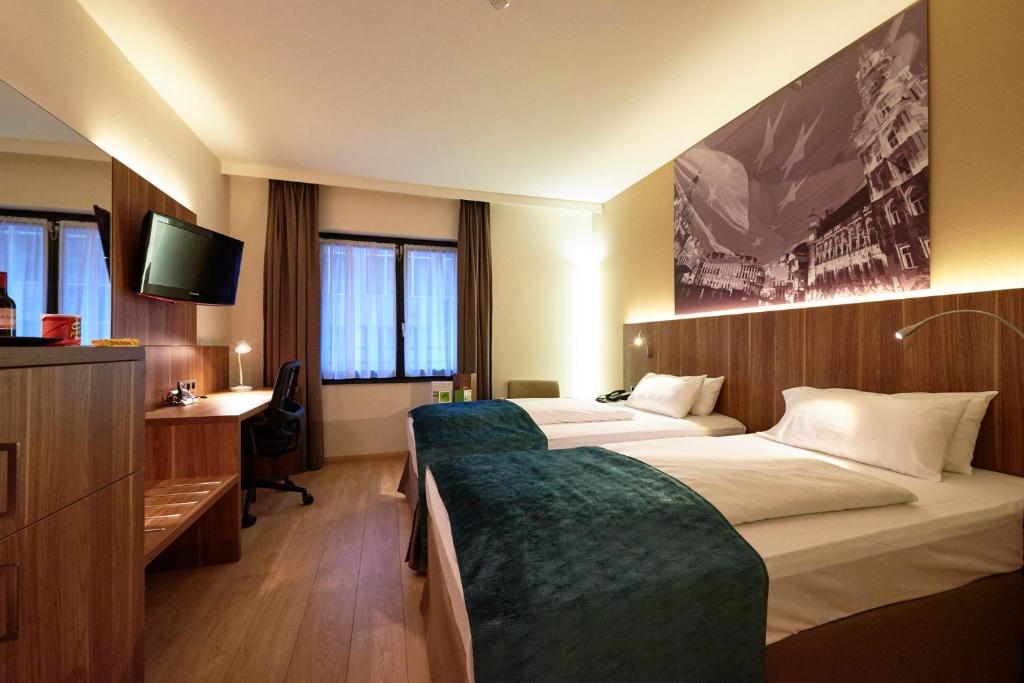 Postel nebo postele na pokoji v ubytování Holiday Inn Brussels Schuman by IHG