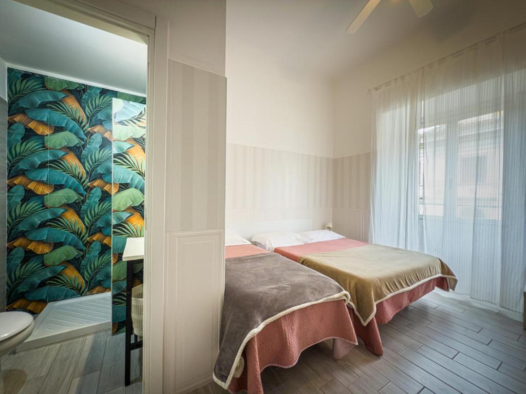Postel nebo postele na pokoji v ubytování Hotel Giada Roma