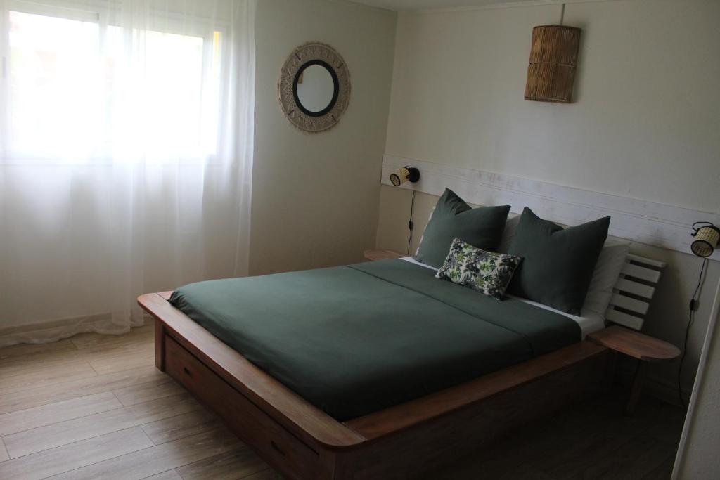 Letto o letti in una camera di LE RUBINJO 2