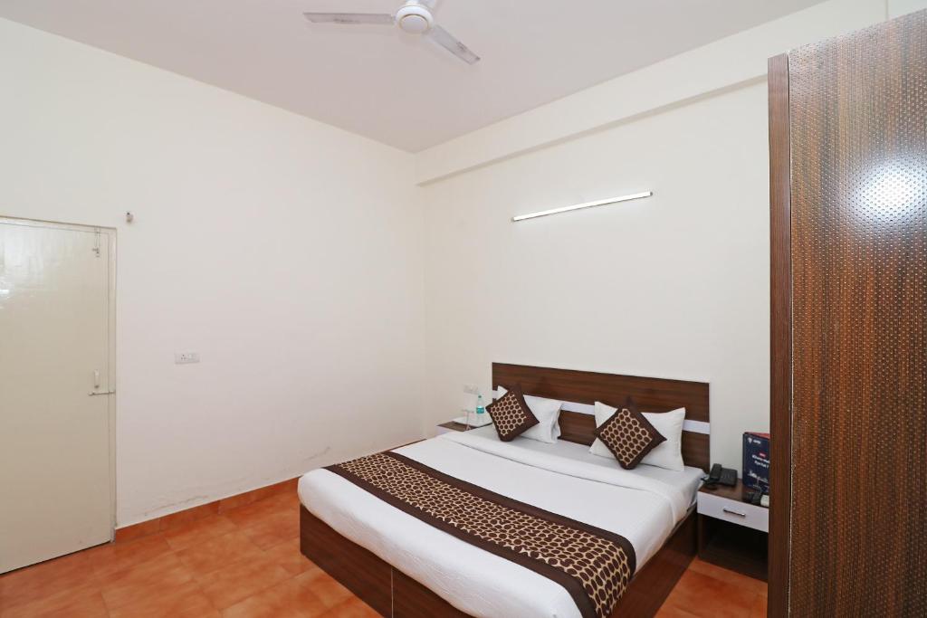 Postel nebo postele na pokoji v ubytování Hotel O Prime Plaza