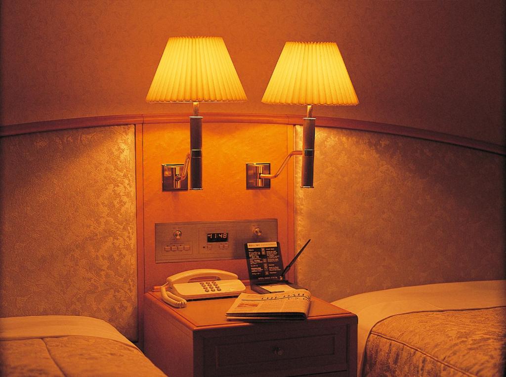 Postel nebo postele na pokoji v ubytování Hotel Green Tower Makuhari