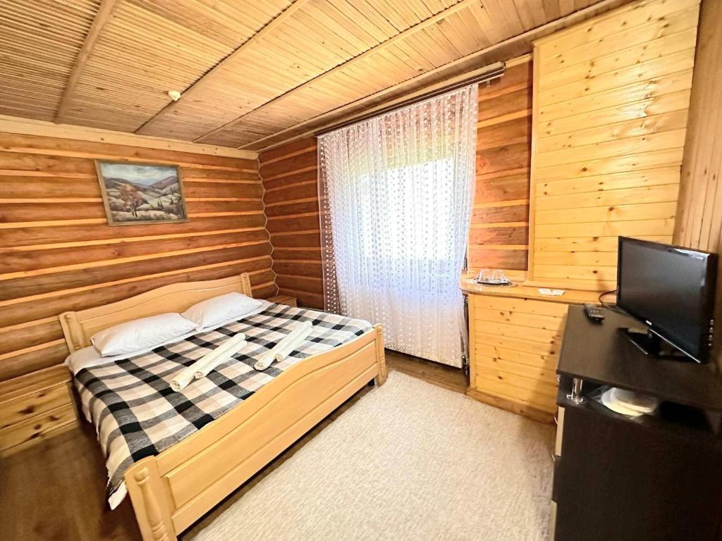Postel nebo postele na pokoji v ubytování Trembita