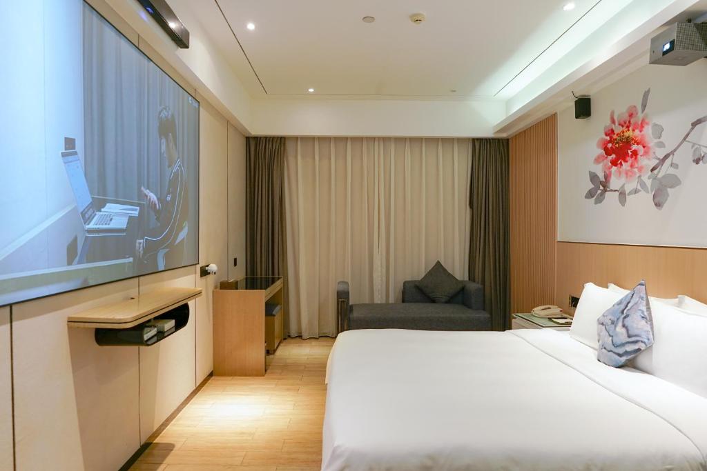 Postelja oz. postelje v sobi nastanitve Paco Hotel Tiyuxilu Metro Guangzhou-Free Shuttle Bus during Canton Fair
