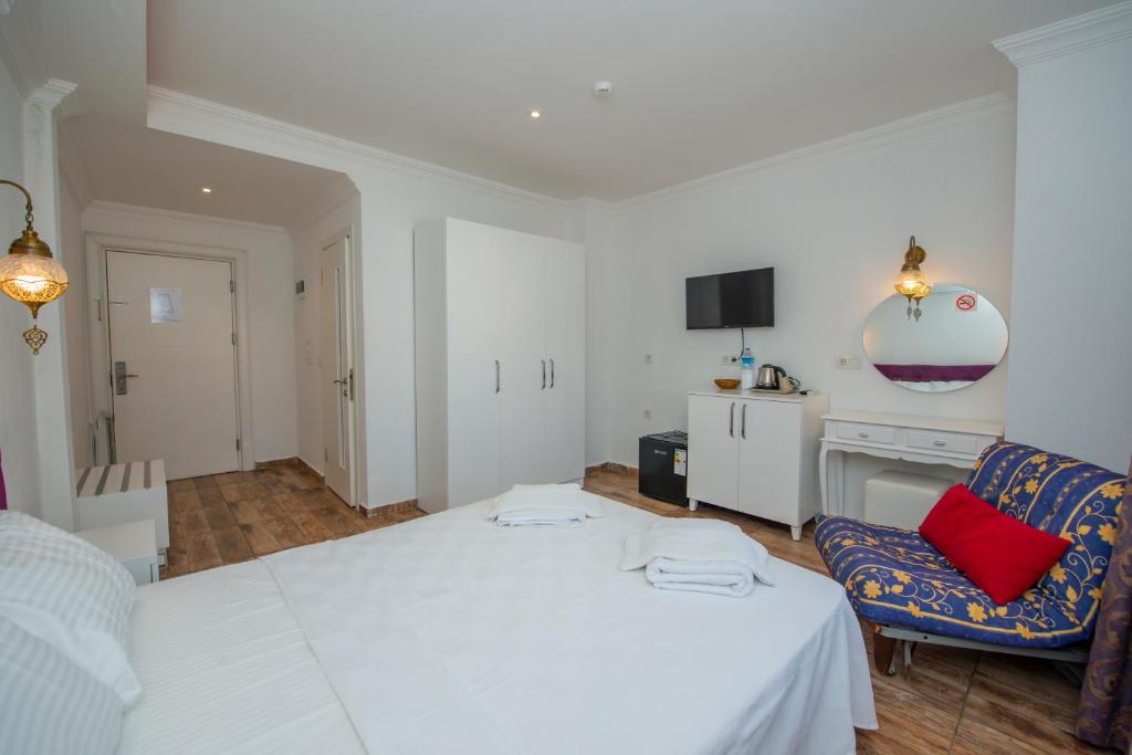 Postel nebo postele na pokoji v ubytování Cennet Life Hotel