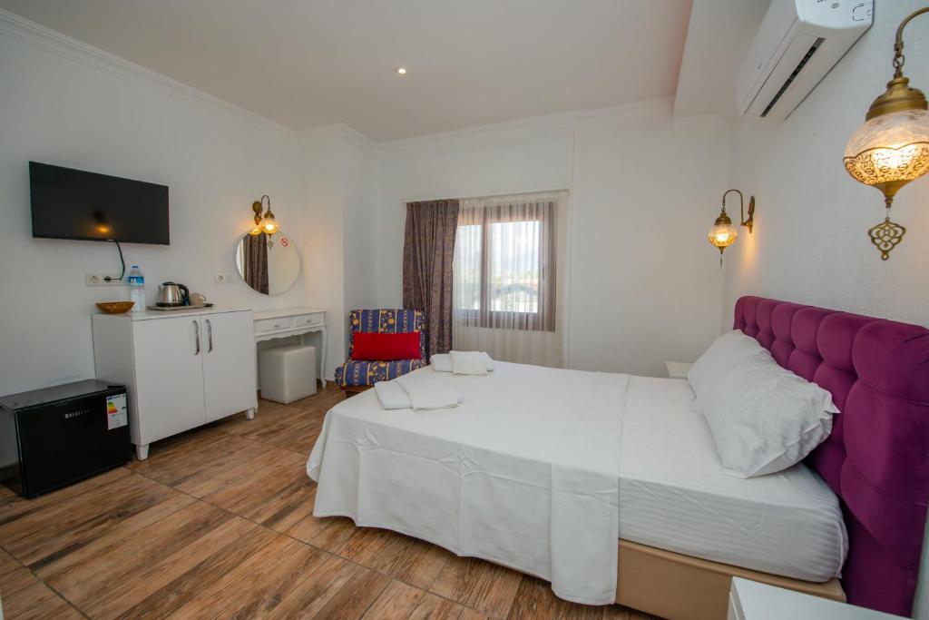 Postel nebo postele na pokoji v ubytování Cennet Life Hotel
