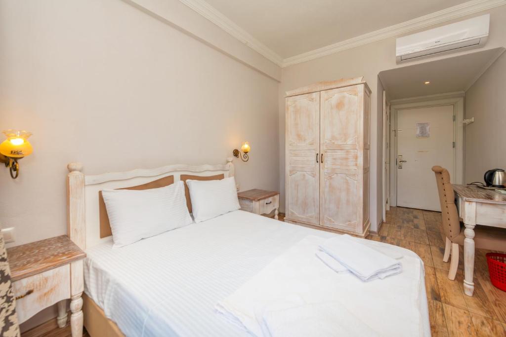 Postel nebo postele na pokoji v ubytování Cennet Life Hotel