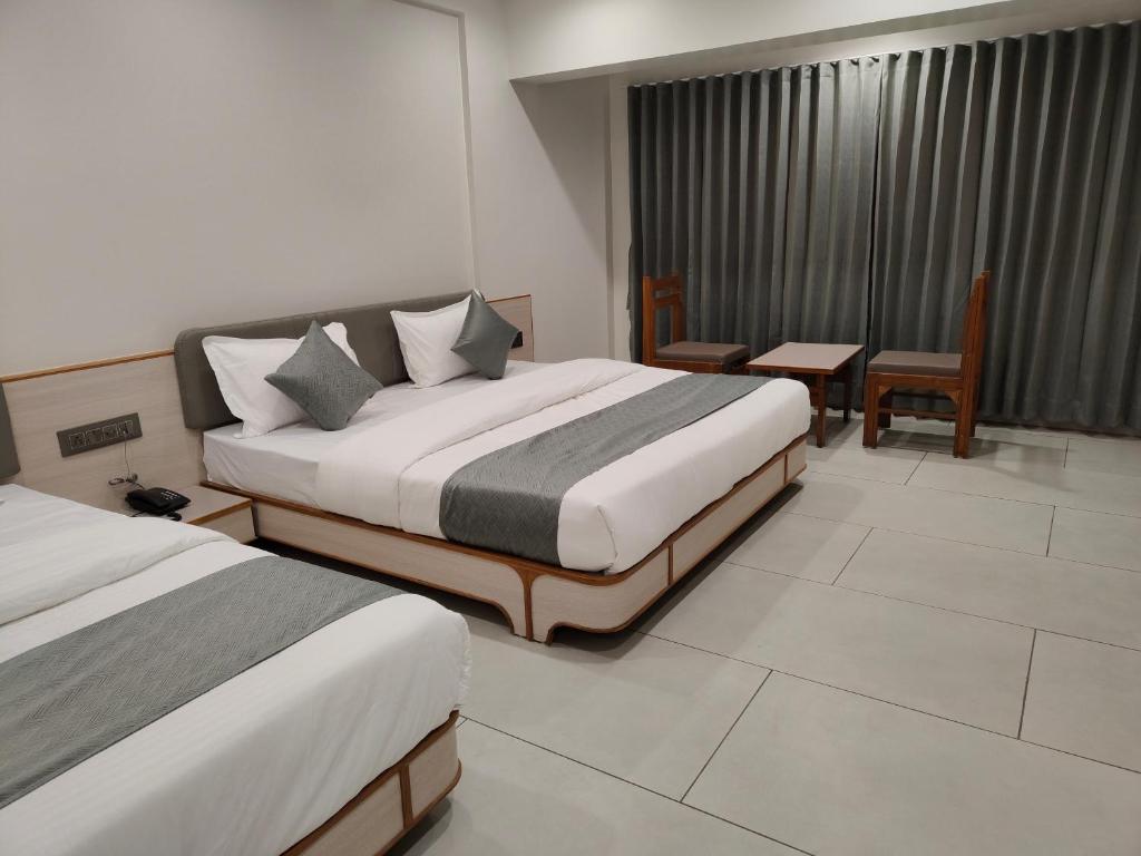 Postel nebo postele na pokoji v ubytování Hotel Kozar