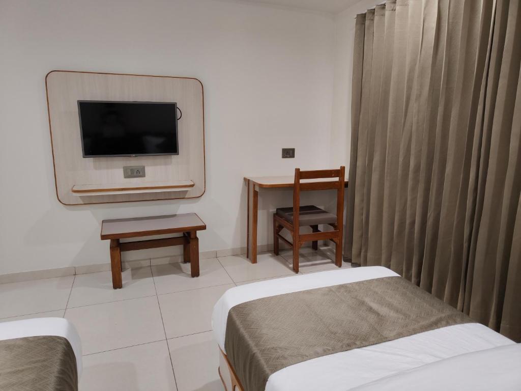 Postel nebo postele na pokoji v ubytování Hotel Kozar