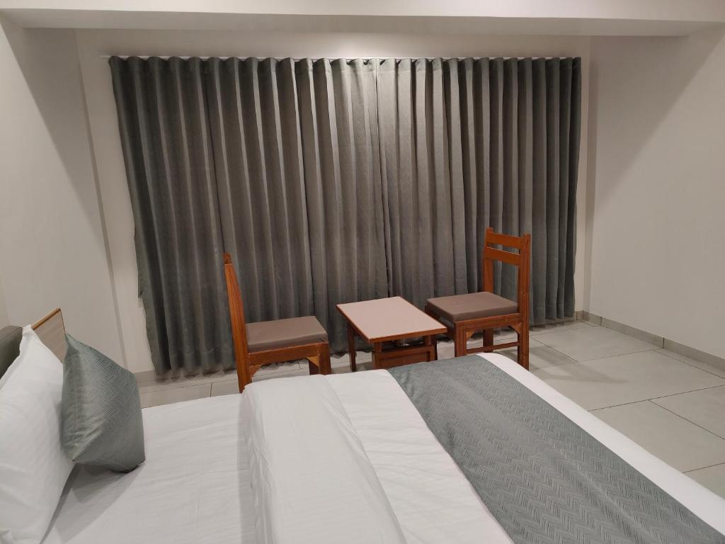 Postel nebo postele na pokoji v ubytování Hotel Kozar
