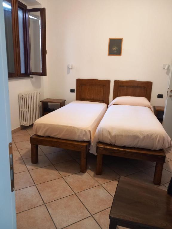 Łóżko lub łóżka w pokoju w obiekcie Acquacheta Valtancoli Hotel B&B