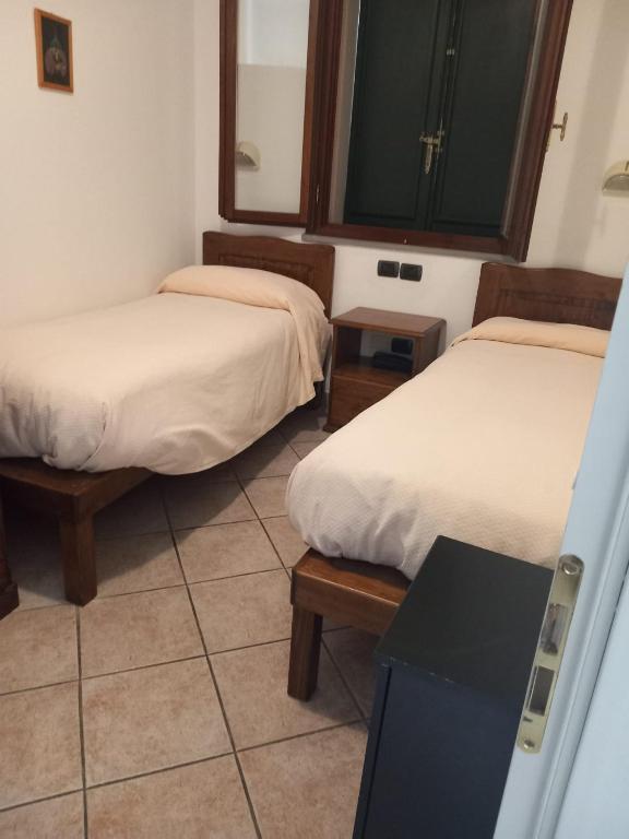 Łóżko lub łóżka w pokoju w obiekcie Acquacheta Valtancoli Hotel B&B