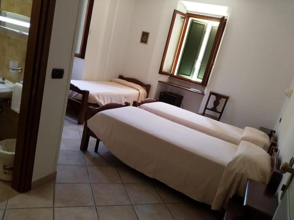 Łóżko lub łóżka w pokoju w obiekcie Acquacheta Valtancoli Hotel B&B