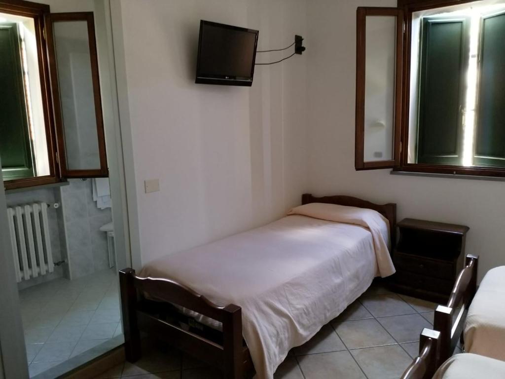 Łóżko lub łóżka w pokoju w obiekcie Acquacheta Valtancoli Hotel B&B