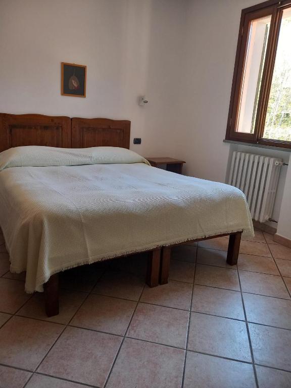 Łóżko lub łóżka w pokoju w obiekcie Acquacheta Valtancoli Hotel B&B