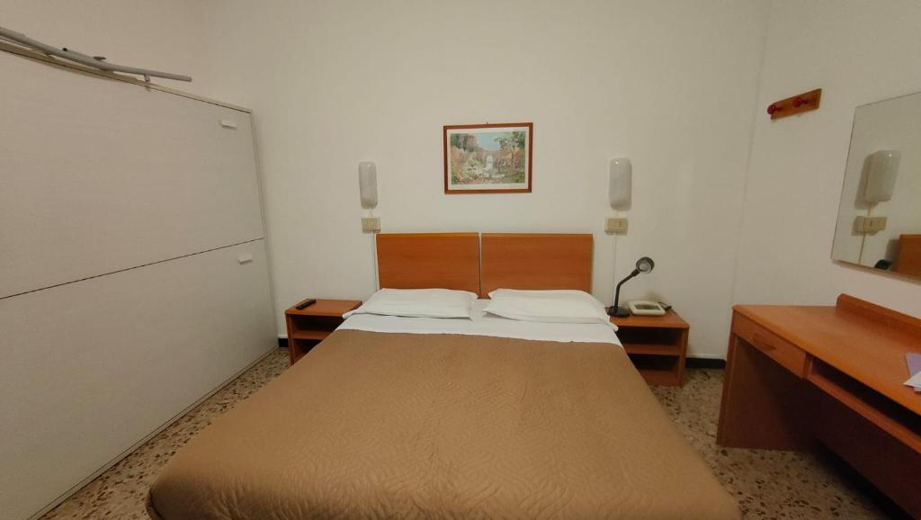 Postel nebo postele na pokoji v ubytování Hotel al Porto