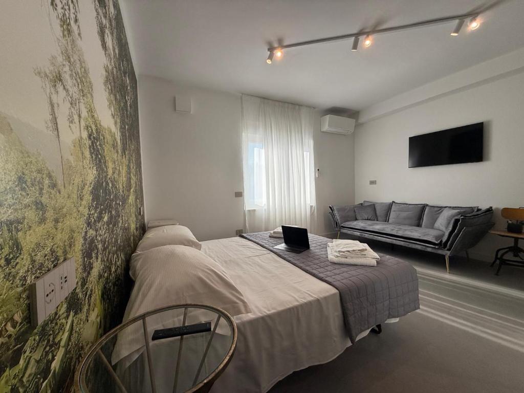 TV a/nebo společenská místnost v ubytování B&B Relax Rooms - Villa Segala