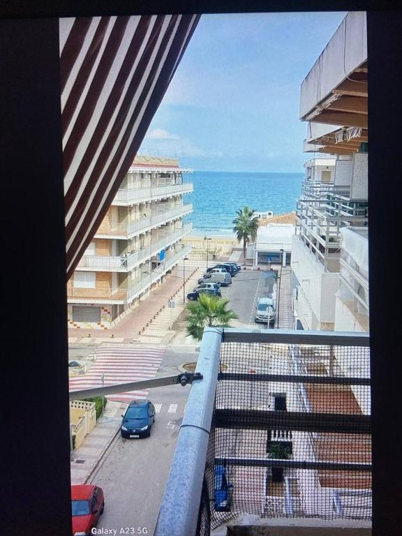 a view of the ocean from the balcony of a building at Apartamento Alicia in Daimuz