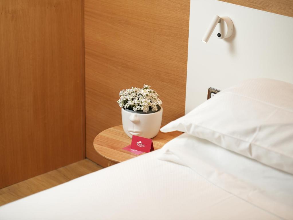 Postel nebo postele na pokoji v ubytování Cavallo Hotel Verona Est