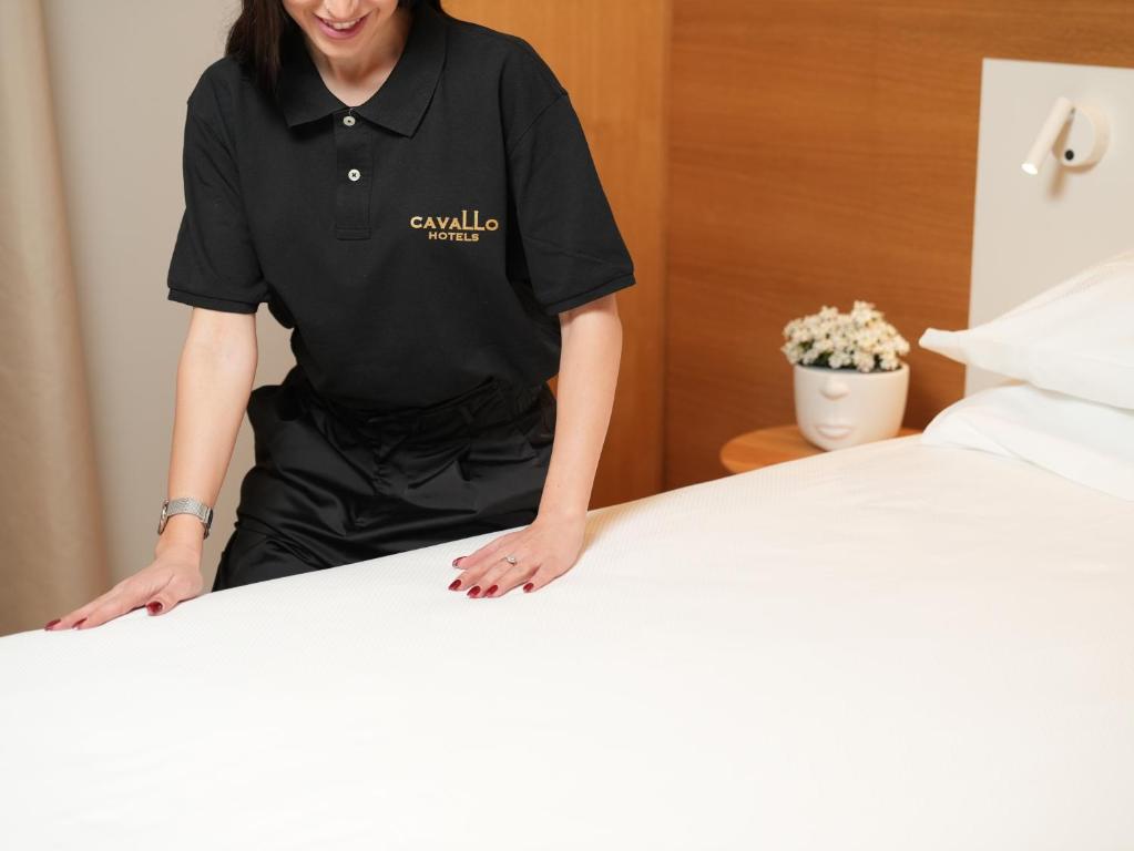 Postel nebo postele na pokoji v ubytování Cavallo Hotel Verona Est