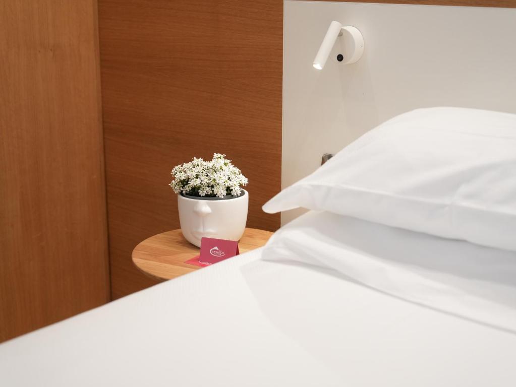 Postel nebo postele na pokoji v ubytování Cavallo Hotel Verona Est