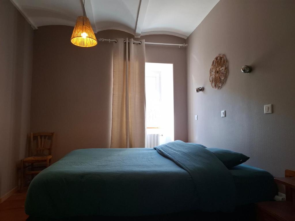 Postel nebo postele na pokoji v ubytování Auberge Arthéa