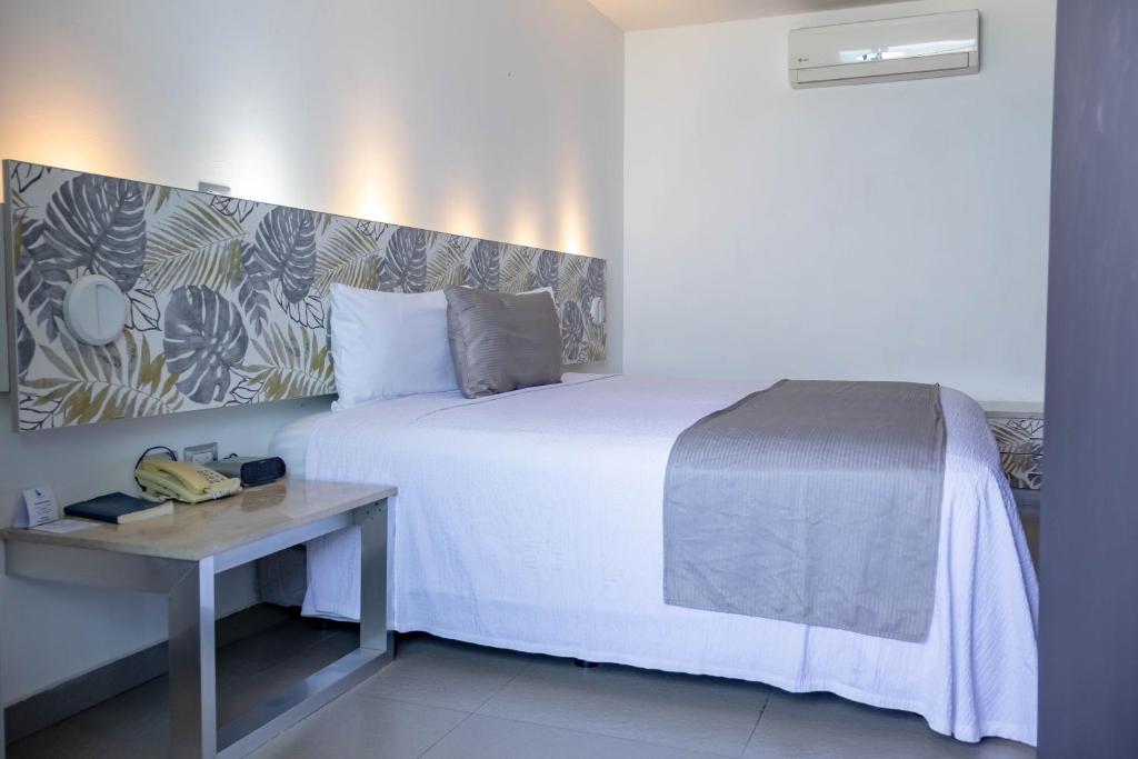 Postel nebo postele na pokoji v ubytování Hotel Punta Azul
