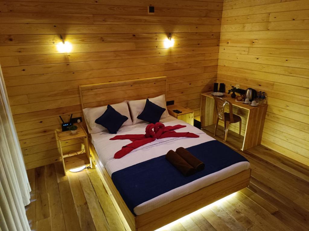Postel nebo postele na pokoji v ubytování Wood Chalets Ella
