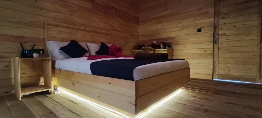 Postel nebo postele na pokoji v ubytování Wood Chalets Ella