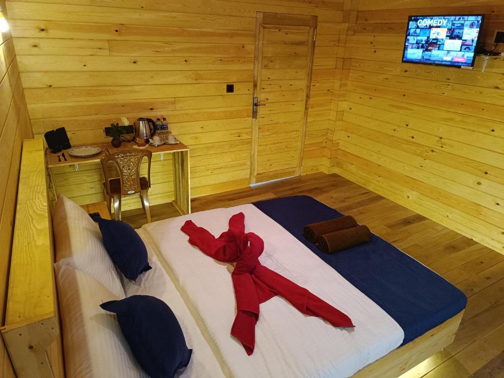 Postel nebo postele na pokoji v ubytování Wood Chalets Ella