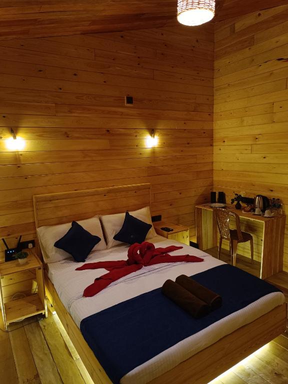 Postel nebo postele na pokoji v ubytování Wood Chalets Ella