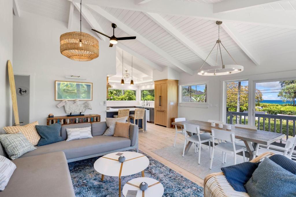a living room with a couch and a table at Camp Magic 1 in Hanalei