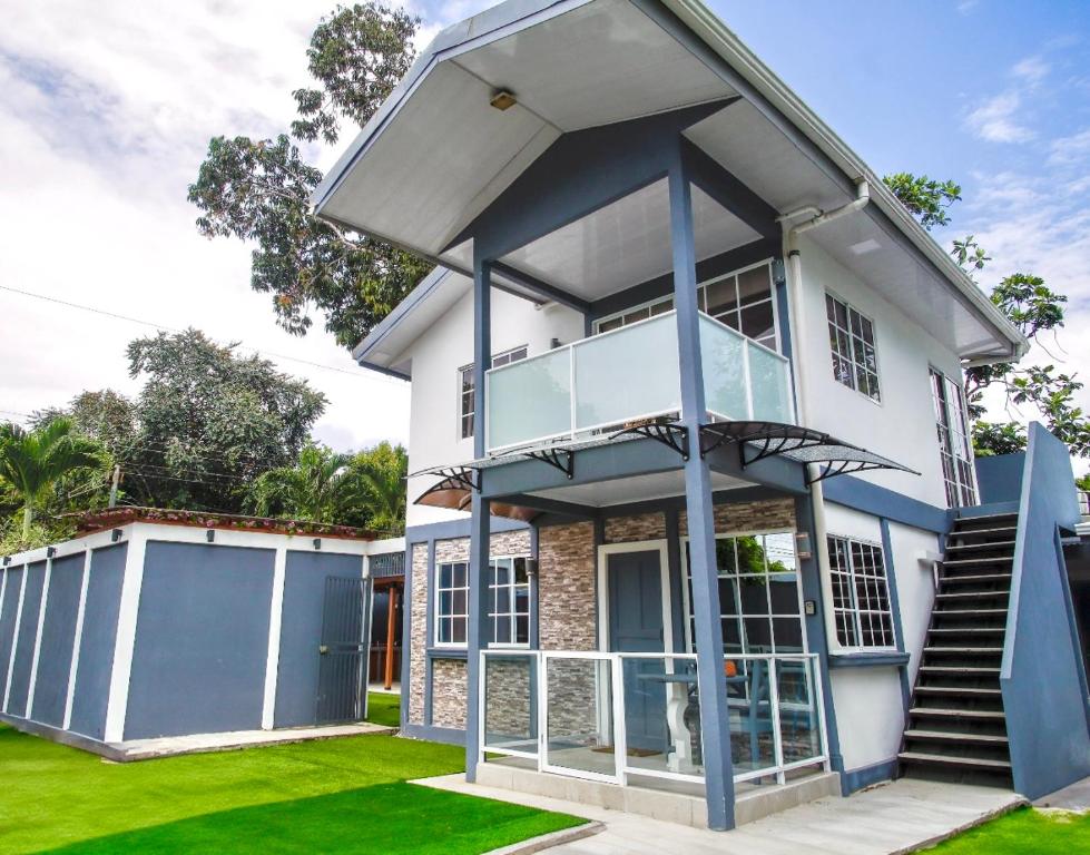 a large white house with a balcony at Deluxe beach house in Westfalia
