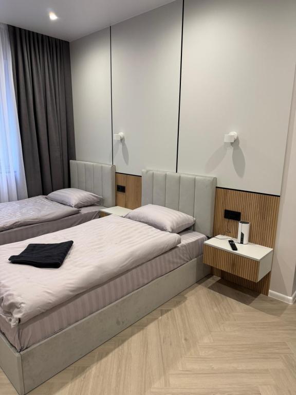 Postel nebo postele na pokoji v ubytování mini-hotel Neptun