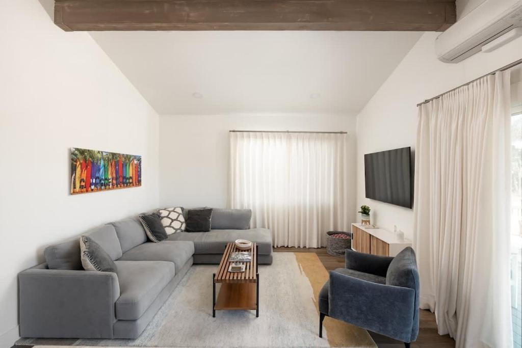 a living room with a couch and two chairs at 2BD Sashas Bungalow Beach Vibes 1 Block Away in San Diego