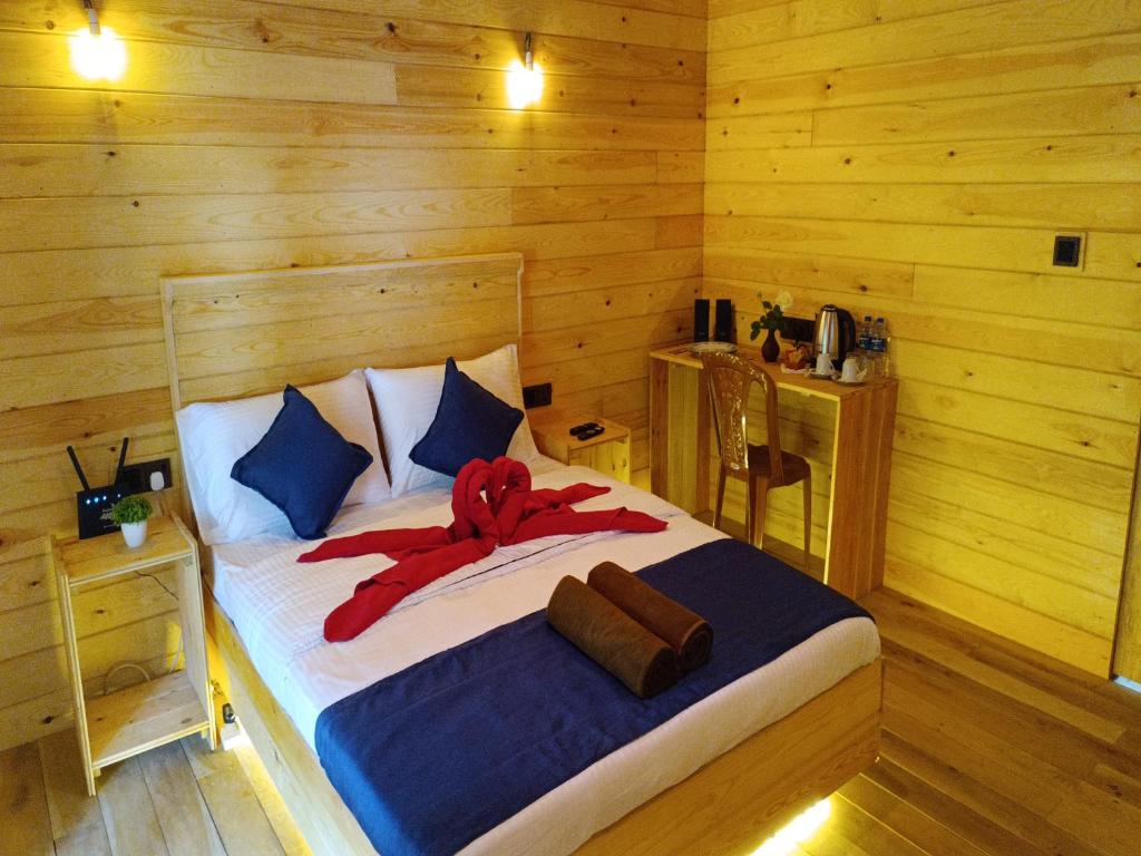 Postel nebo postele na pokoji v ubytování Wood Chalets Ella