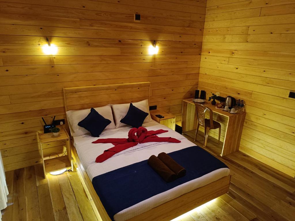Postel nebo postele na pokoji v ubytování Wood Chalets Ella